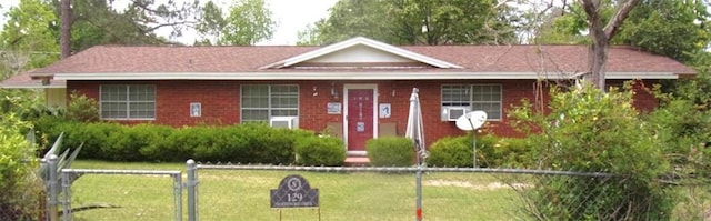 129 Northwood Dr, Fitzgerald, GA 31750 - ranch-style house with a front lawn, fence, and brick siding