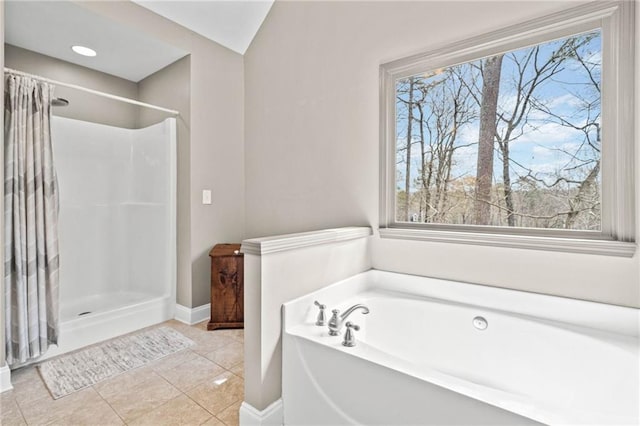 bathroom with a garden tub, baseboards, a shower with shower curtain, and tile patterned floors