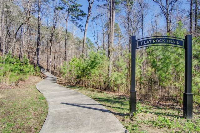 view of property's community featuring a view of trees