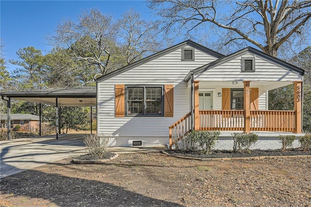 view of front of house with a carport and a porch