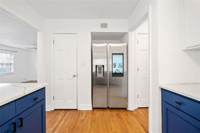 kitchen featuring blue cabinetry, sink, white cabinetry, dishwasher, and decorative backsplash