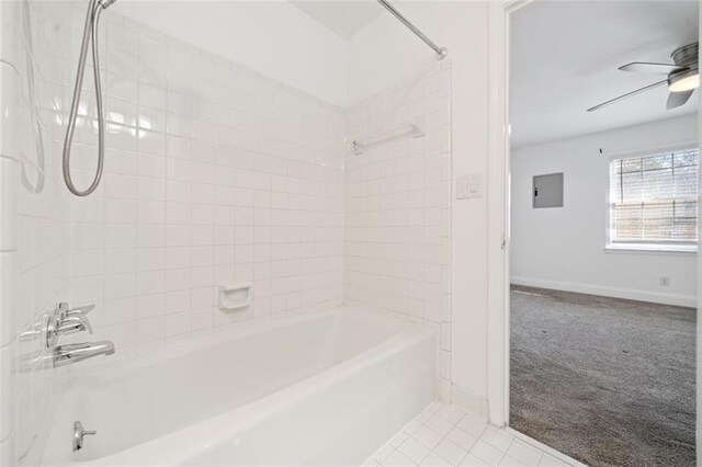 full bathroom with tiled shower / bath, vanity, and toilet