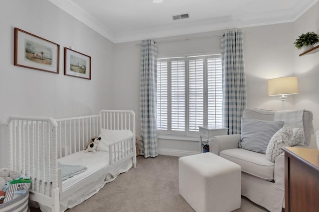 carpeted bedroom with ornamental molding, visible vents, and baseboards