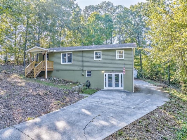 111 Sylvan Dr, Calhoun, GA 30701 - rear view of property with french doors and driveway