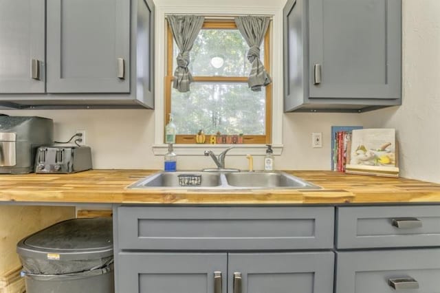 111 Sylvan Dr, Calhoun, GA 30701 - kitchen with butcher block counters, gray cabinets, and a sink