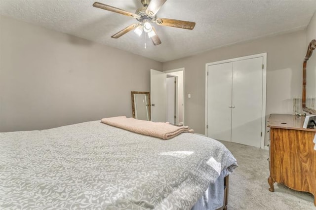111 Sylvan Dr, Calhoun, GA 30701 - bedroom with light carpet, a closet, a textured ceiling, and a ceiling fan