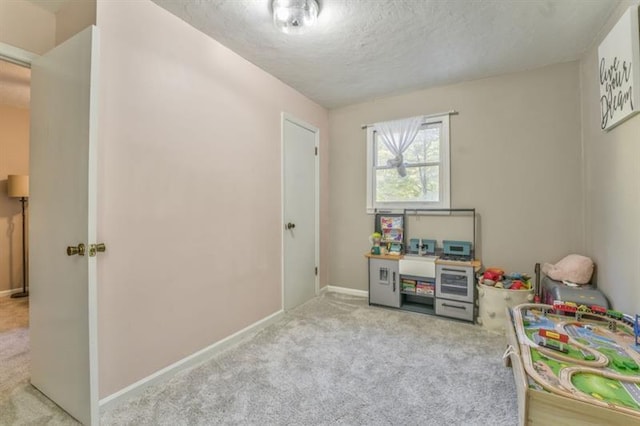 111 Sylvan Dr, Calhoun, GA 30701 - rec room with carpet flooring, baseboards, and a textured ceiling