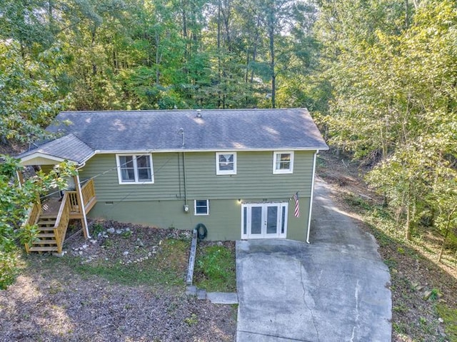 111 Sylvan Dr, Calhoun, GA 30701 - rear view of house with french doors, stairway, roof with shingles, and driveway