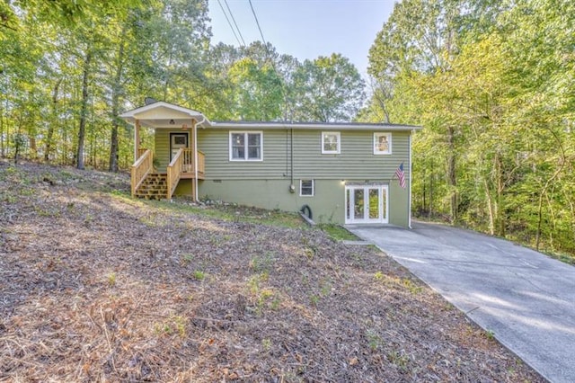 111 Sylvan Dr, Calhoun, GA 30701 - rear view of property with french doors and driveway