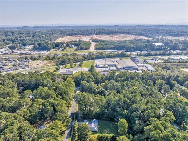 111 Sylvan Dr, Calhoun, GA 30701 - aerial view of property's location with a heavily wooded area