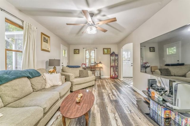 111 Sylvan Dr, Calhoun, GA 30701 - living area with wood finished floors, healthy amount of natural light, ceiling fan, and arched walkways