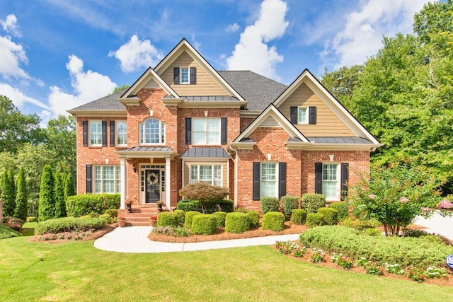 craftsman-style home with a front lawn