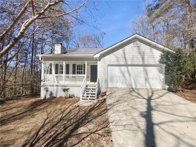 ranch-style house with covered porch, driveway, a chimney, and an attached garage