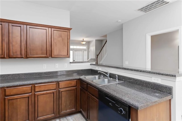 kitchen with dishwasher, sink, and kitchen peninsula