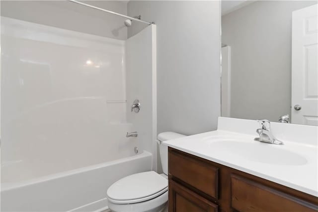 full bathroom featuring vanity, toilet, and washtub / shower combination