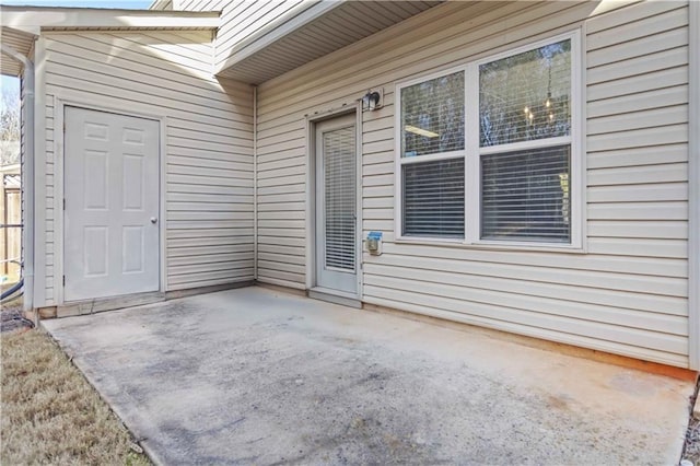 doorway to property with a patio area