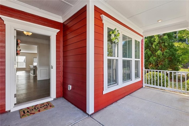 doorway to property featuring covered porch
