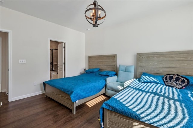 bedroom with baseboards, a chandelier, and wood finished floors