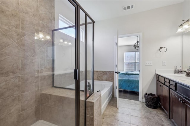 ensuite bathroom with vanity, ensuite bathroom, a shower stall, visible vents, and a bath