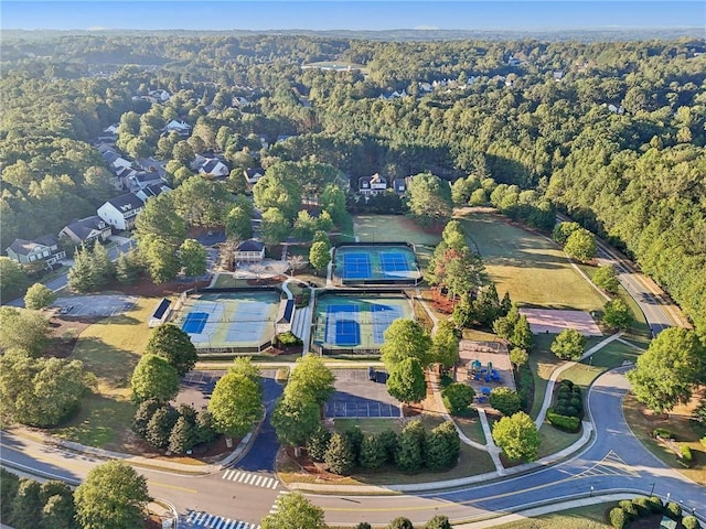 drone / aerial view featuring a forest view