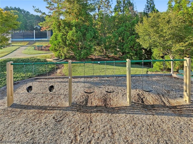 view of yard with playground community and fence