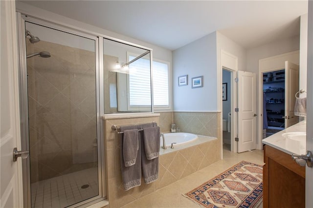 full bathroom with vanity, tile patterned flooring, a shower stall, and a bath