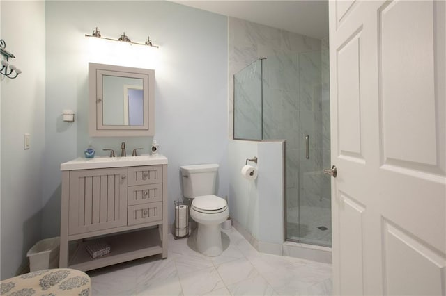 bathroom with toilet, marble finish floor, a shower stall, and vanity