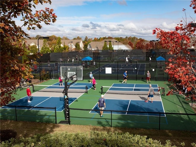 view of tennis court with fence