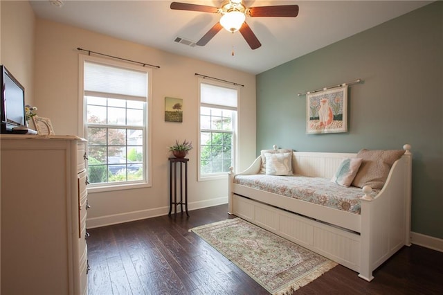 sitting room featuring baseboards, visible vents, ceiling fan, and dark wood-style flooring