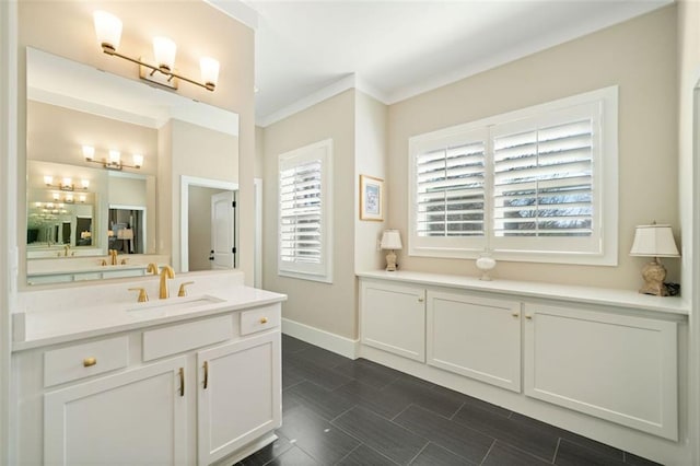 bathroom with vanity and ornamental molding