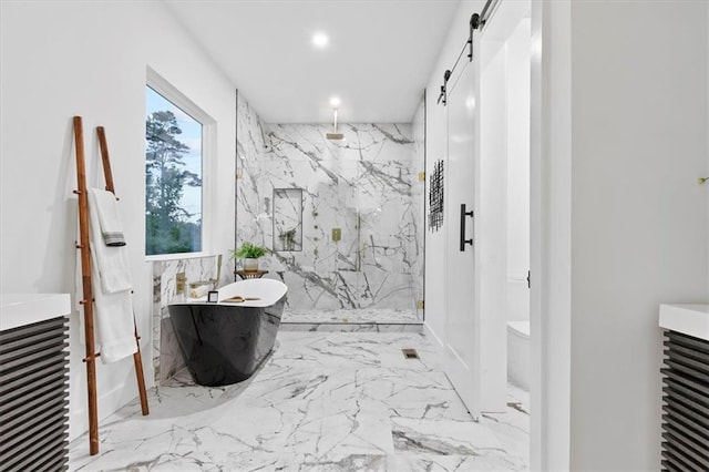 full bathroom featuring separate shower and tub, vanity, and toilet