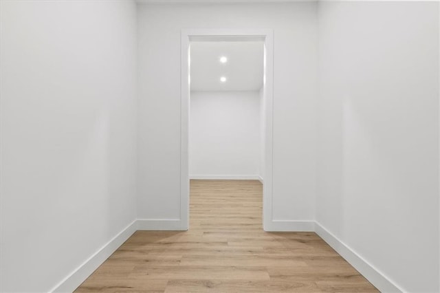 hall with light hardwood / wood-style flooring