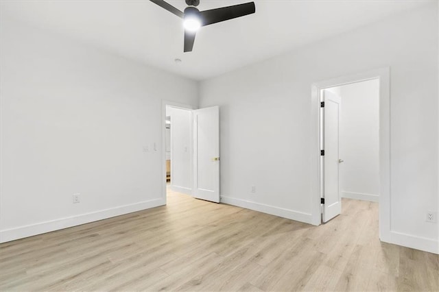 spare room featuring ceiling fan and light wood-type flooring