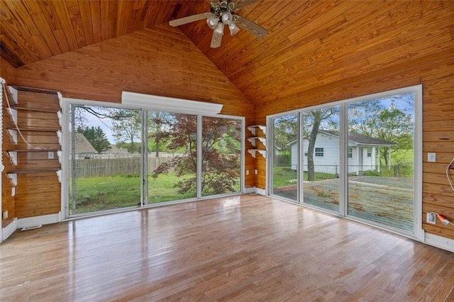 unfurnished sunroom with wood ceiling, ceiling fan, and vaulted ceiling