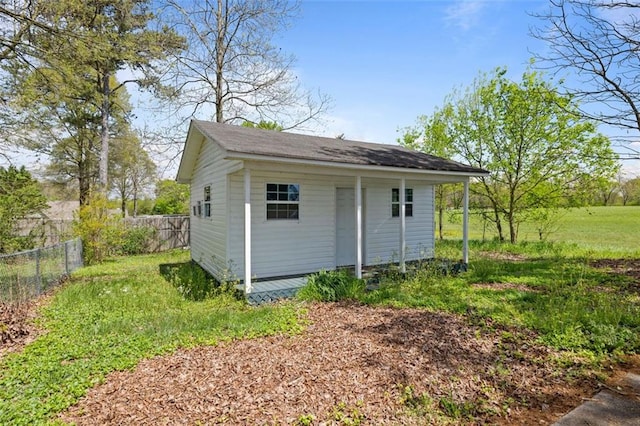 view of outbuilding featuring a yard