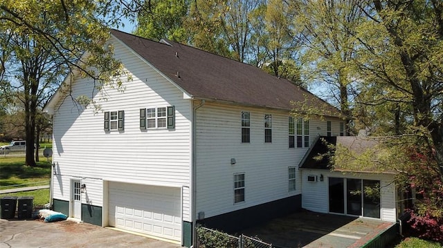 view of side of property with a garage