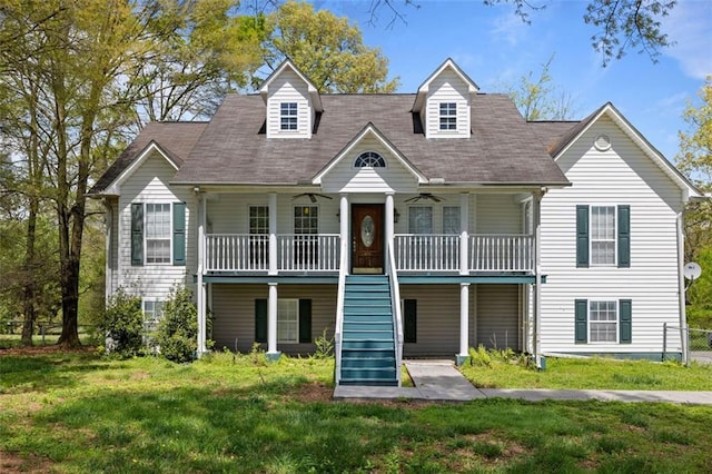 view of front of home with a porch and a front yard