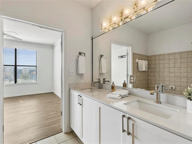 bathroom featuring tile patterned flooring and vanity