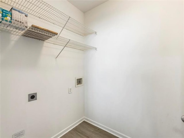 laundry area with electric dryer hookup, dark hardwood / wood-style floors, and hookup for a washing machine