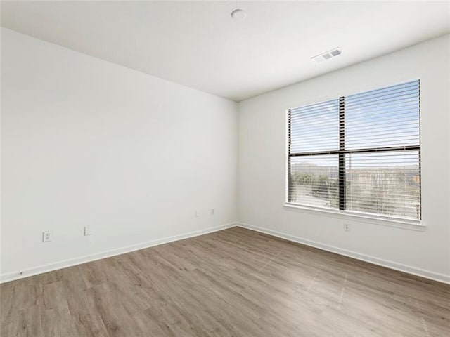 empty room featuring wood-type flooring