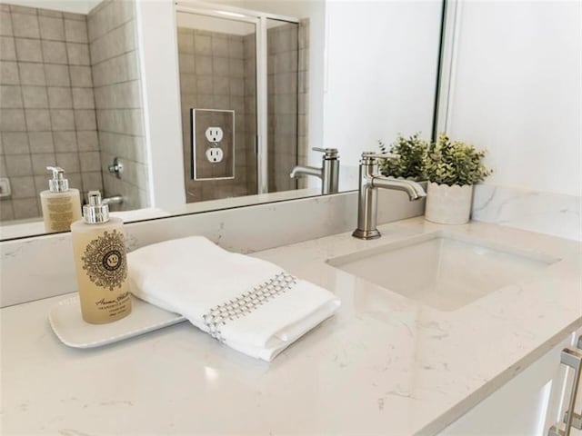 bathroom with vanity and an enclosed shower