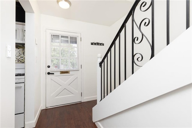 doorway with dark hardwood / wood-style flooring