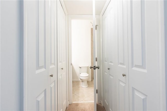 bathroom with light tile patterned flooring