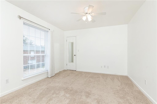 carpeted empty room with ceiling fan