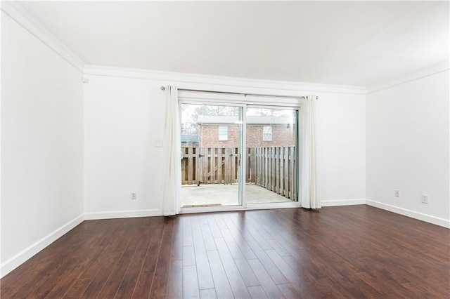 unfurnished room with ornamental molding and dark hardwood / wood-style floors