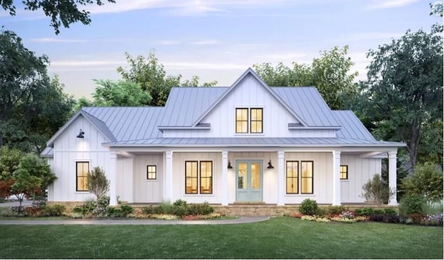 modern farmhouse with a front lawn and a porch