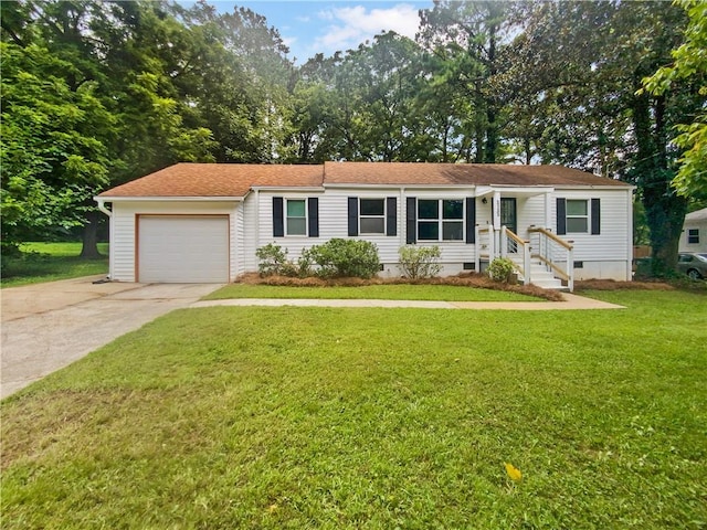 ranch-style house featuring a garage and a front yard