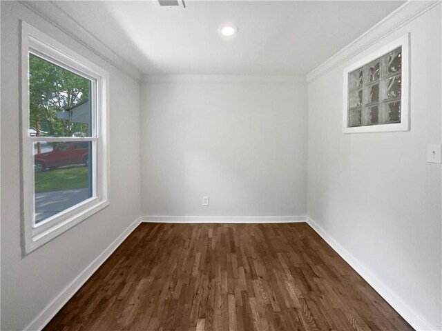 2122 Belhaven Ln SE, Atlanta, GA 30315 - unfurnished room featuring dark wood-style flooring, visible vents, crown molding, baseboards, and recessed lighting