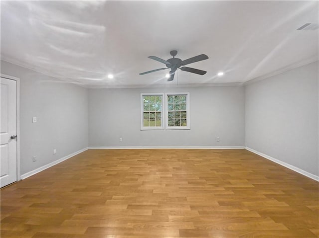 unfurnished room with crown molding, ceiling fan, and light hardwood / wood-style flooring