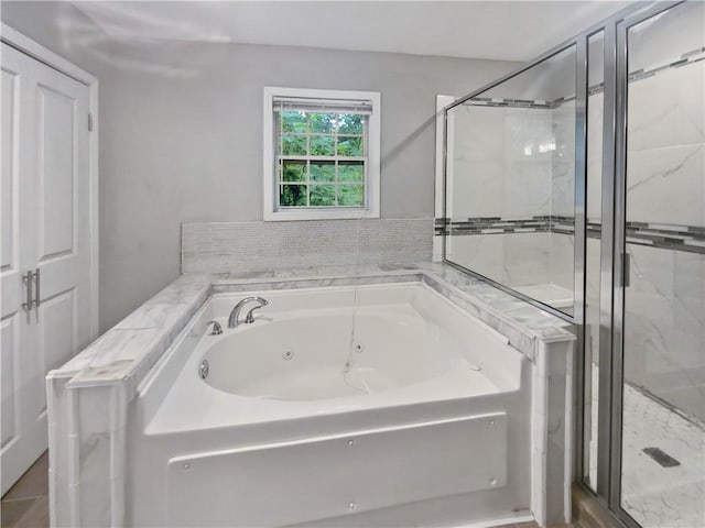 bathroom with independent shower and bath